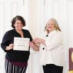 Dr. Rebecca O. Turner presents a certificate to University of Montevallo student Mary Ellie Tarpley.