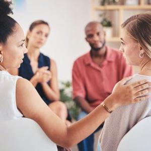 Psychology, mental health and support with a woman in counseling for help with depression and anxiety with a psychologist she can trust. Communication, community and counselor with a sad patient